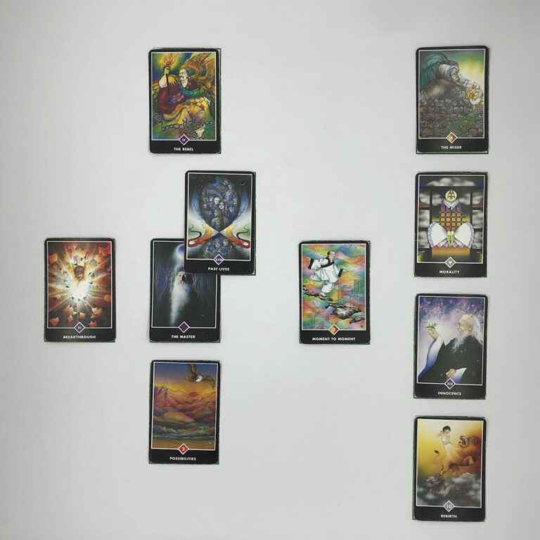 Celtic Cross Layout of daily cards.1 is Now, card is The Master.2 is Influence, card is Past Lives.3 is Goal, card is The Rebel.4 is Distant Past, card is Moment to Moment.5 is Recent Past, card is Possibilities.6 is Future Energy, card is Breakthrough.7 is Feelings, card is Rebirth.8 is Others’ views, card is Innocence.9 is Hopes & Fears, card is Morality.10 is Outcome, card is The Miser.